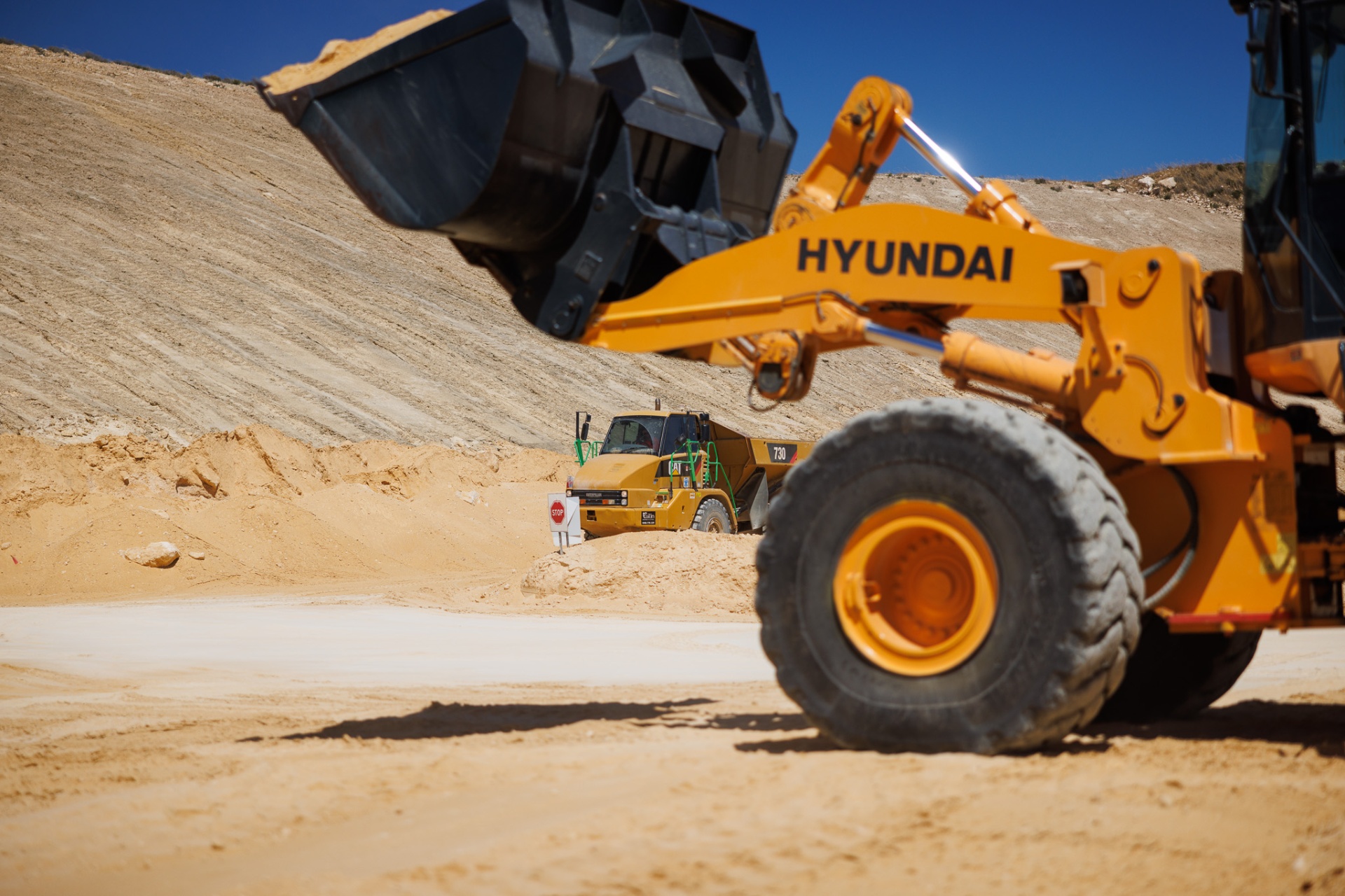 Moxy training Perth — dump truck and loader operating together on site